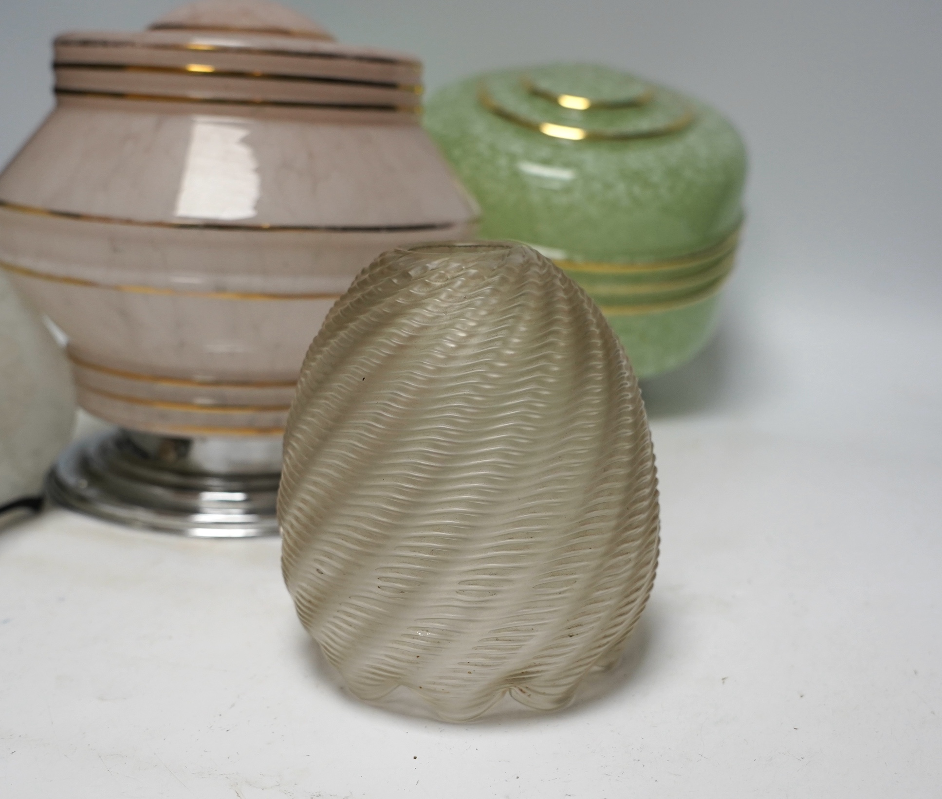 Four Art Deco glass light shades and an earlier glass shade